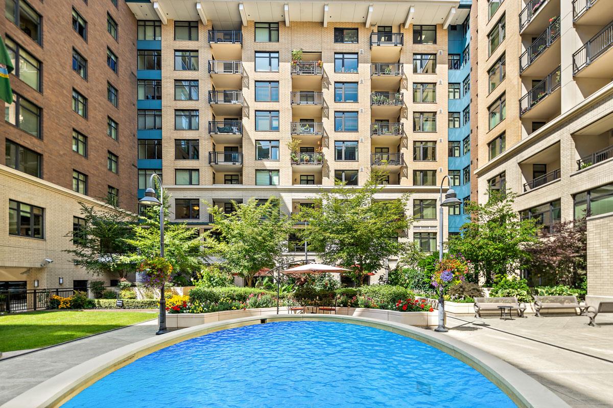 Exterior shot of a Mirabella Seattle residence with a pool.